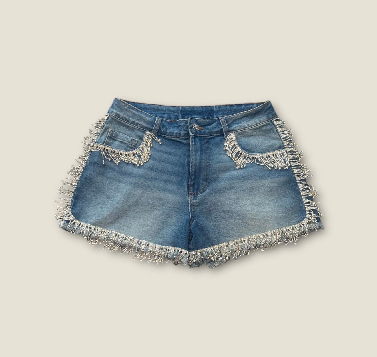 Pantalón corto bordeado flecos pedrería