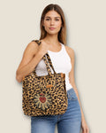 Bolso animal print con sagrado corazón