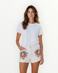 Pantalón corto con flores y strass